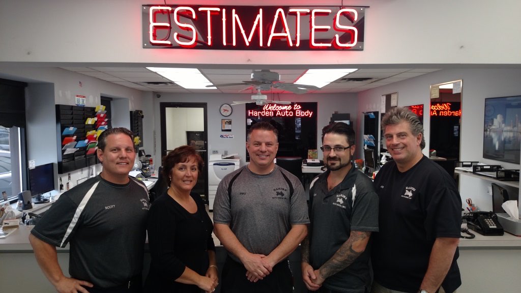 The Harden Auto Body office crew behind the front counter